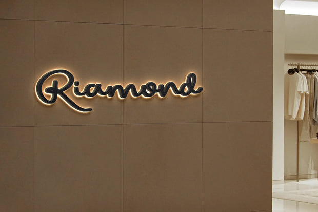 Riamond illuminated storefront halo-lit channel letter signage